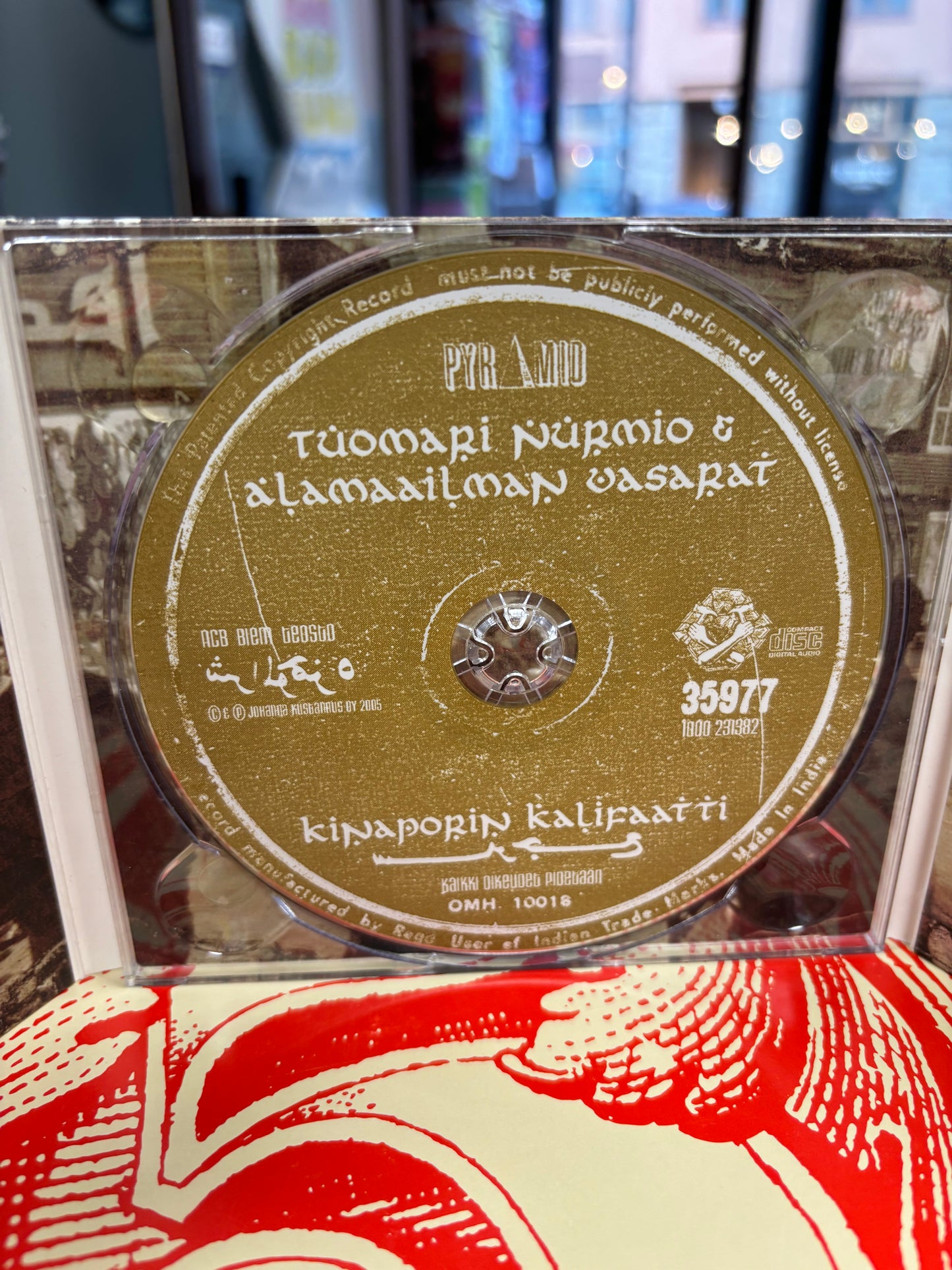 Tuomari Nurmio & Alamaailman Vasarat: Kinaporin Kalifaatti, CD, DVD, Pyramid, Scandinavia 2005